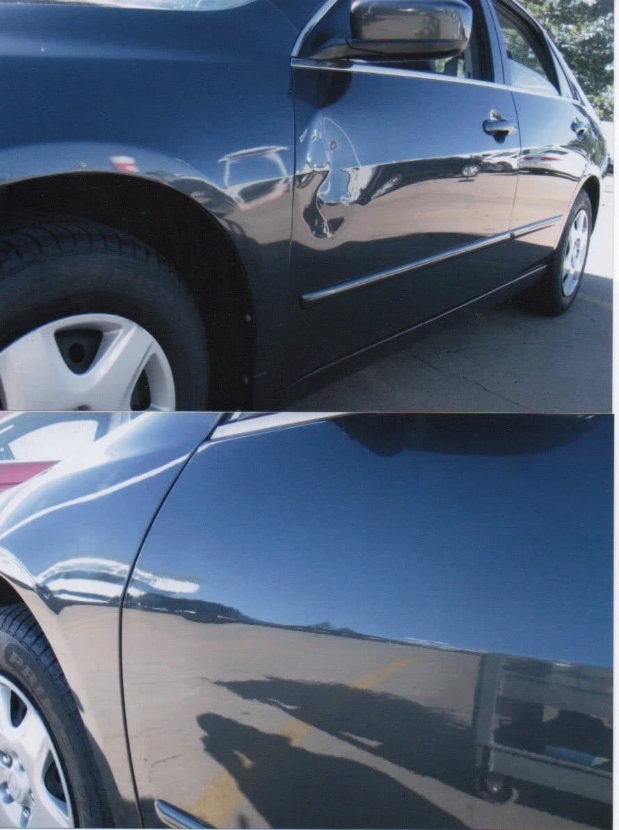 Close-up of a black sedan with scratches and dents on the driver's side door.