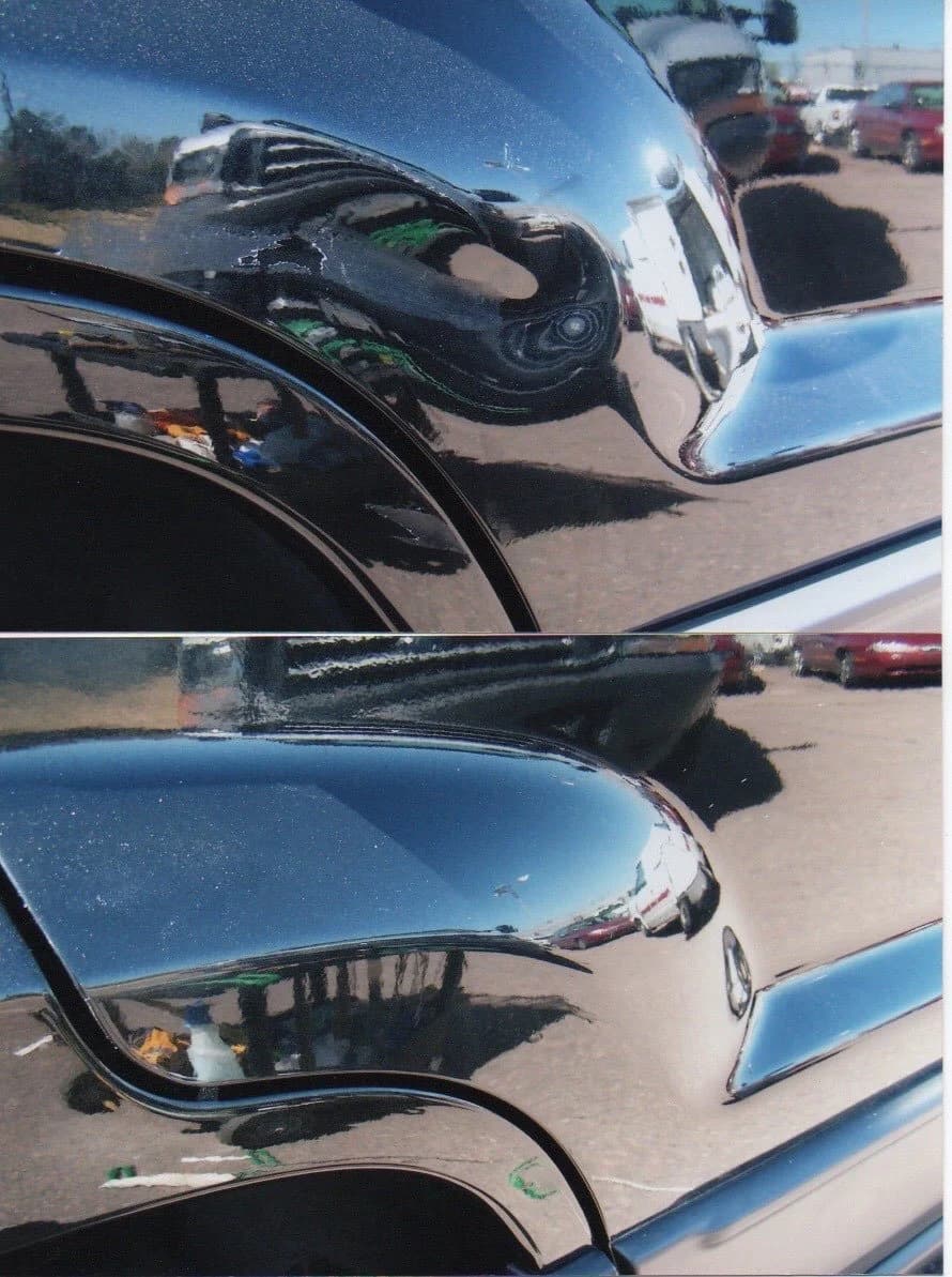 Close-up view of a repaired black vehicle surface.
